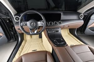 Luxury car interior with Mercedes-Benz dashboard, premium leather seats, and modern infotainment system, showcasing high-end automotive design and comfort.
