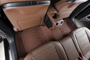 1. Custom brown car floor mats and seat covers with diamond quilted patterns for Mercedes-Benz luxury vehicle interior protection.