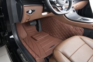 Luxurious brown leather car floor mats inside a Mercedes-Benz, premium interior, custom auto accessories, elegant vehicle decor, high-quality car mats for Mercedes.